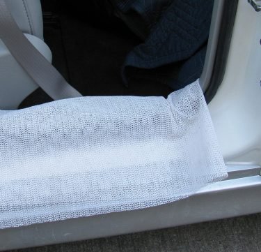 Shelf and drawer liner to protect car door sill from dog nails